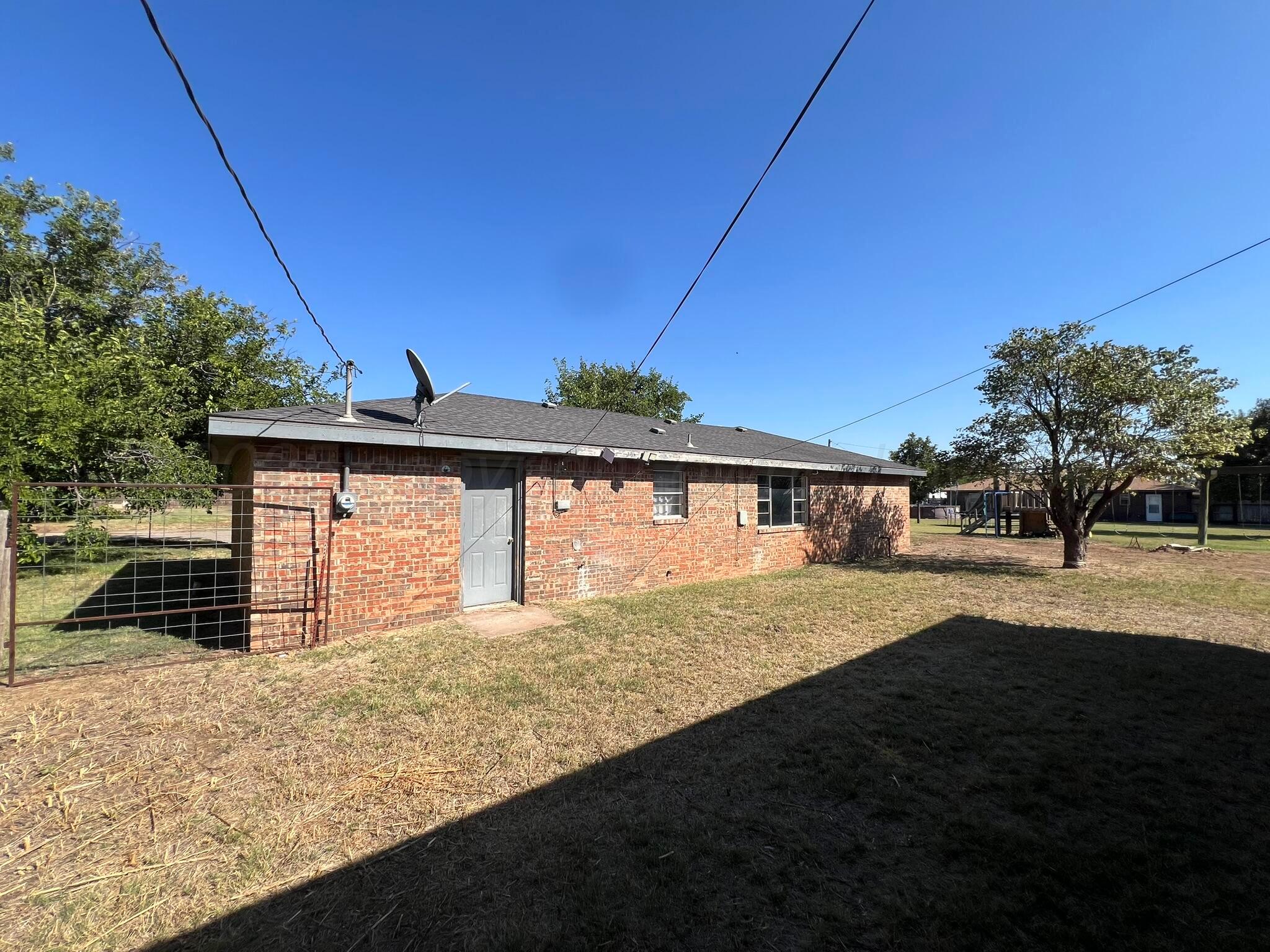 2005 North 20th Street Memphis, TX 79245 - Photo 19 of 19 a view of a house with a yard