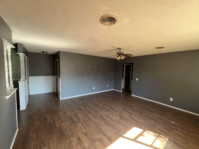 a view of a livingroom with a refrigerator