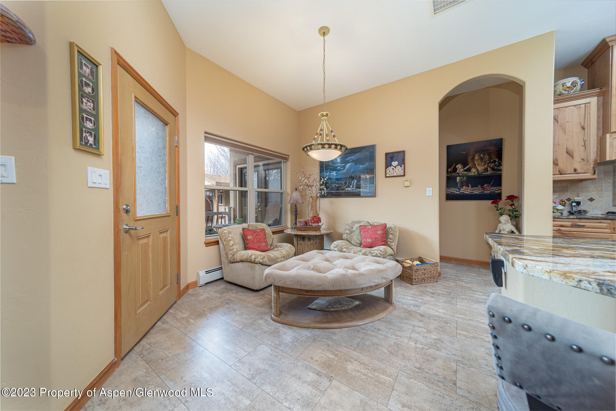 685 Roundup Drive Grand Junction, CO 81507 - Photo 13 of 39 a living room with furniture and a chandelier
