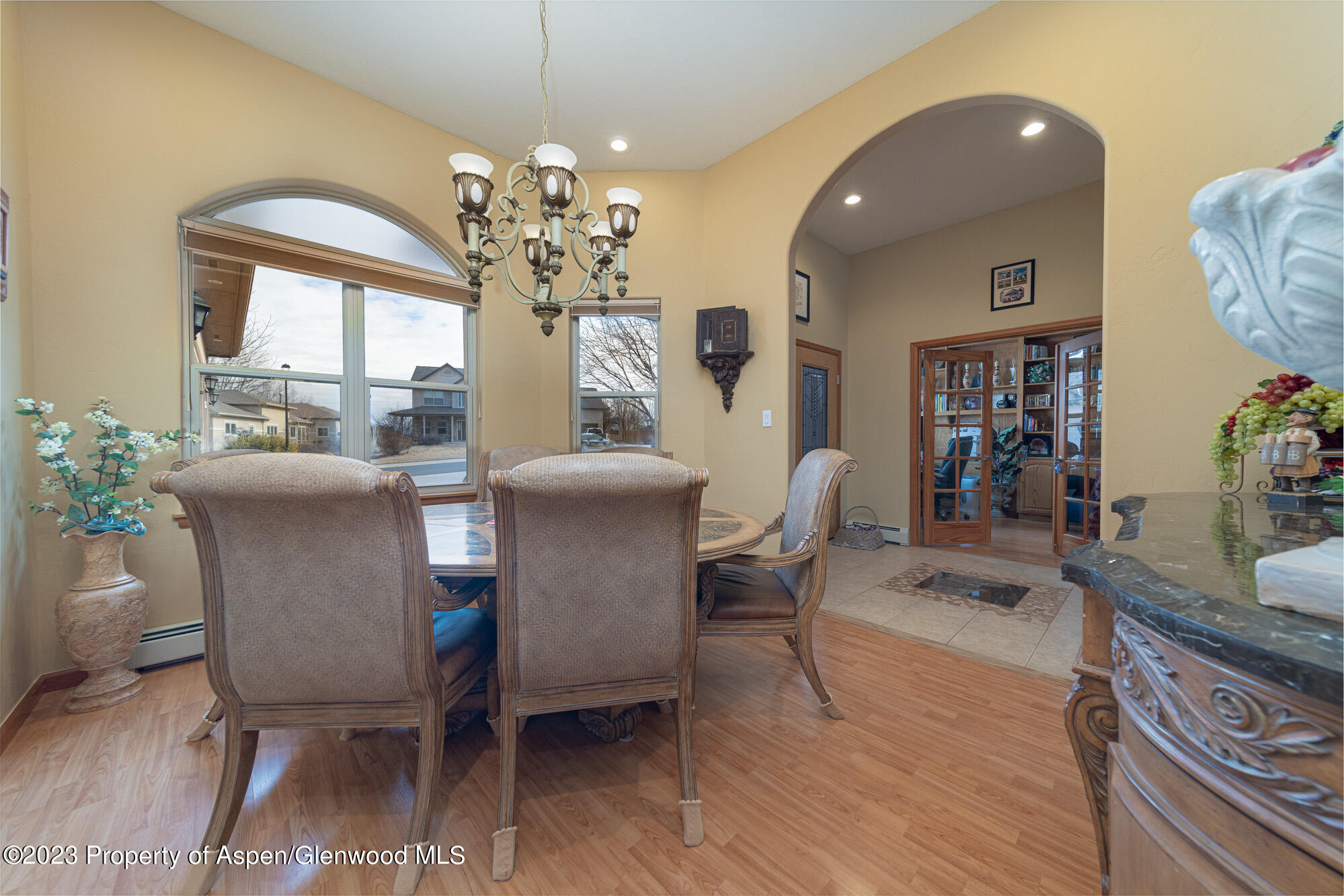 685 Roundup Drive Grand Junction, CO 81507 - Photo 16 of 39 a view of a dining room with furniture and chandelier