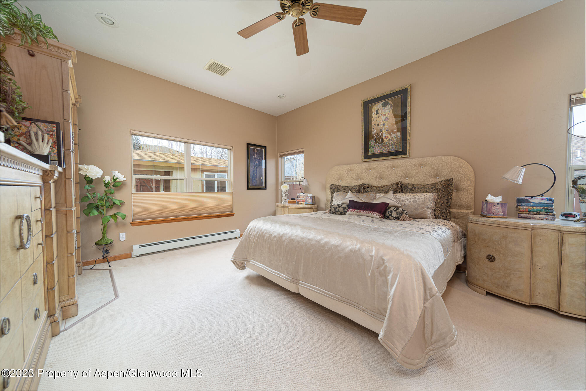 685 Roundup Drive Grand Junction, CO 81507 - Photo 18 of 39 a bedroom with a bed and a chandelier
