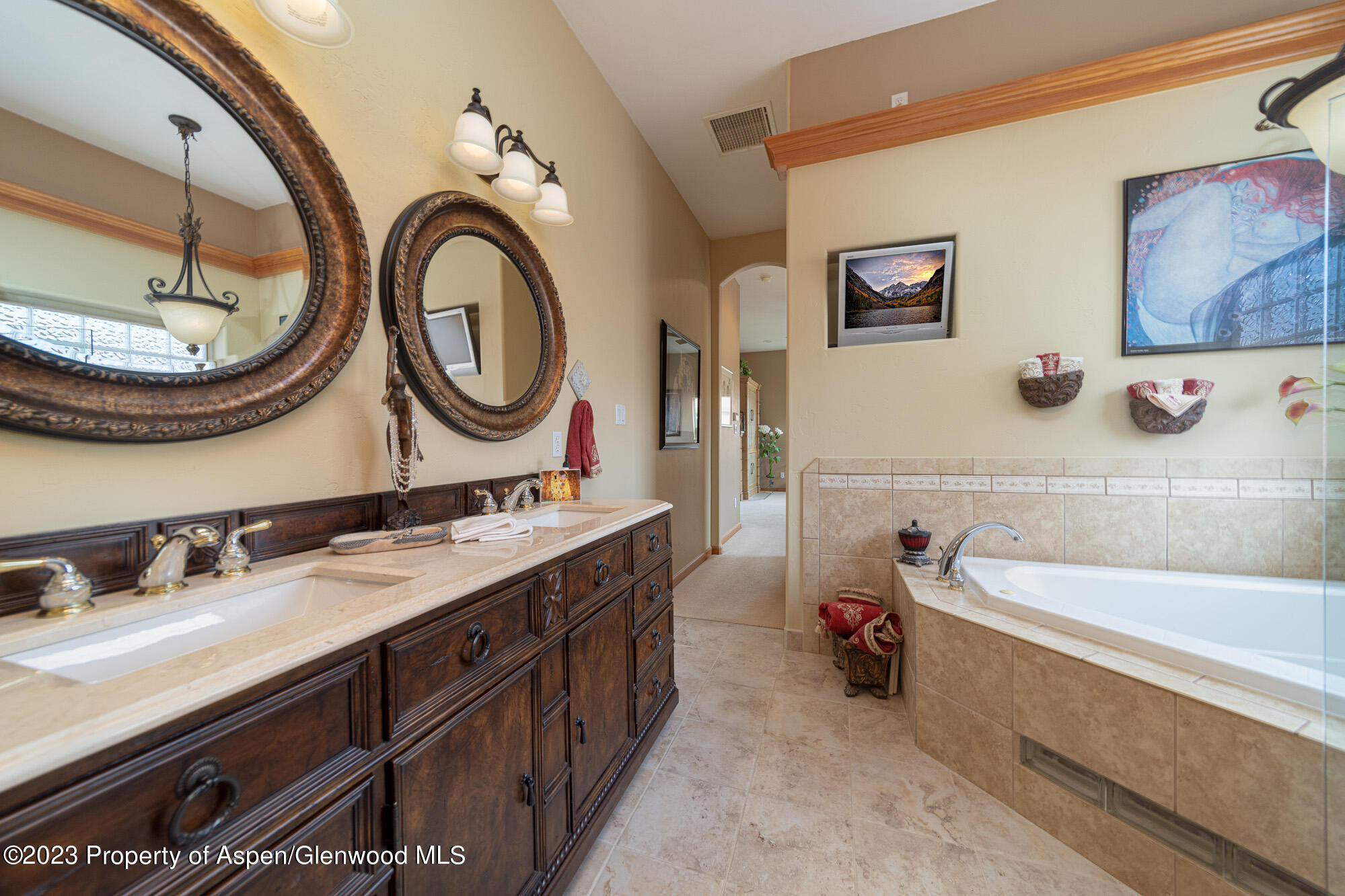 685 Roundup Drive Grand Junction, CO 81507 - Photo 20 of 39 a bath room with a sink and a mirror