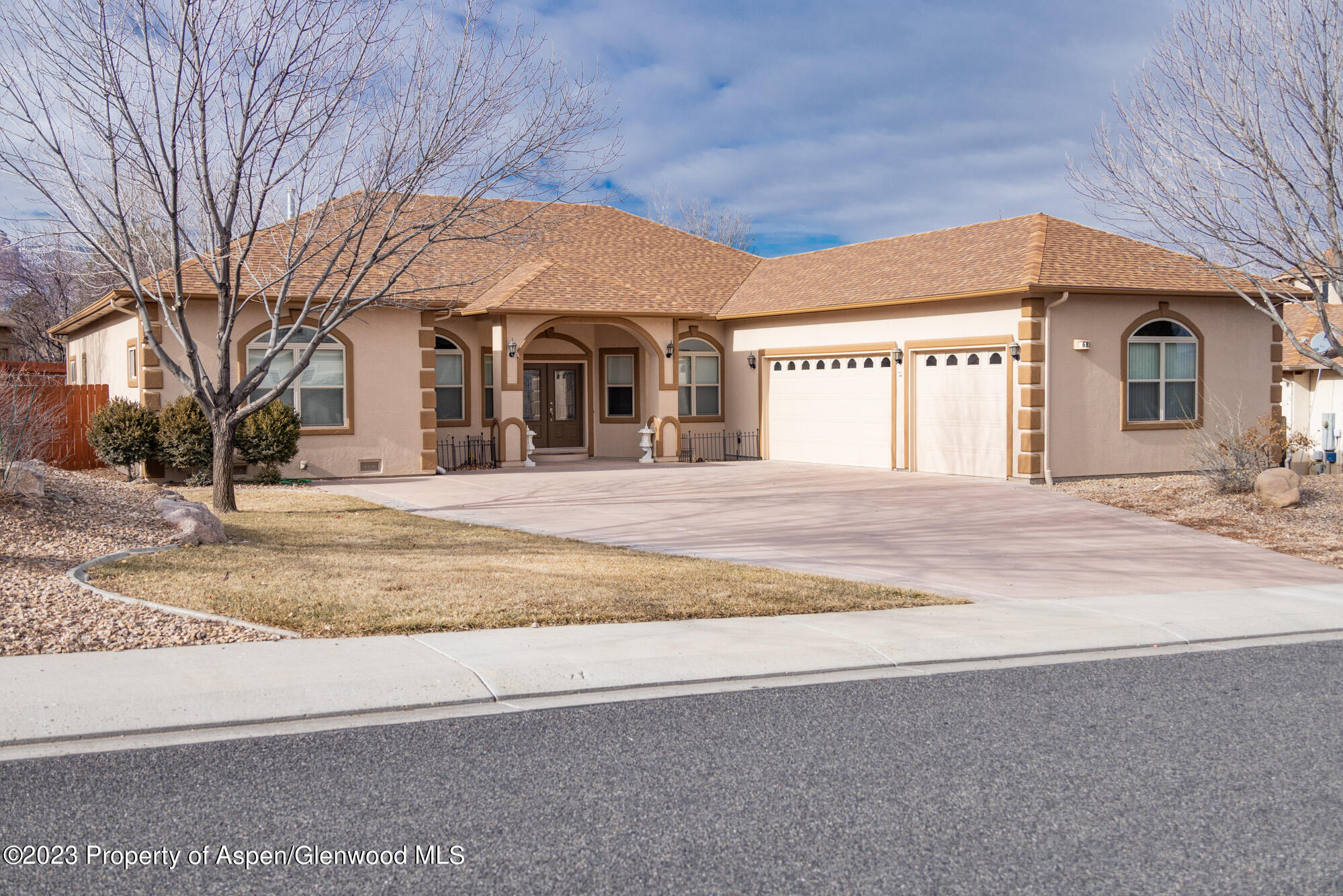 685 Roundup Drive Grand Junction, CO 81507 - Photo 2 of 39 a front view of a house with a yard