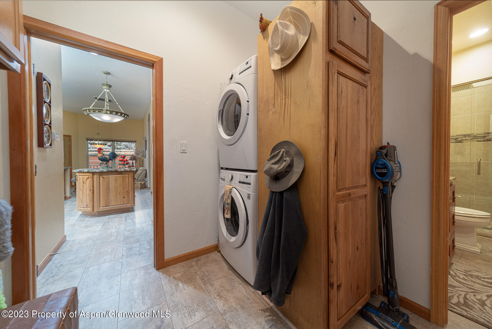 685 Roundup Drive Grand Junction, CO 81507 - Photo 32 of 39 a view of a storage and utility room with washer and dryer