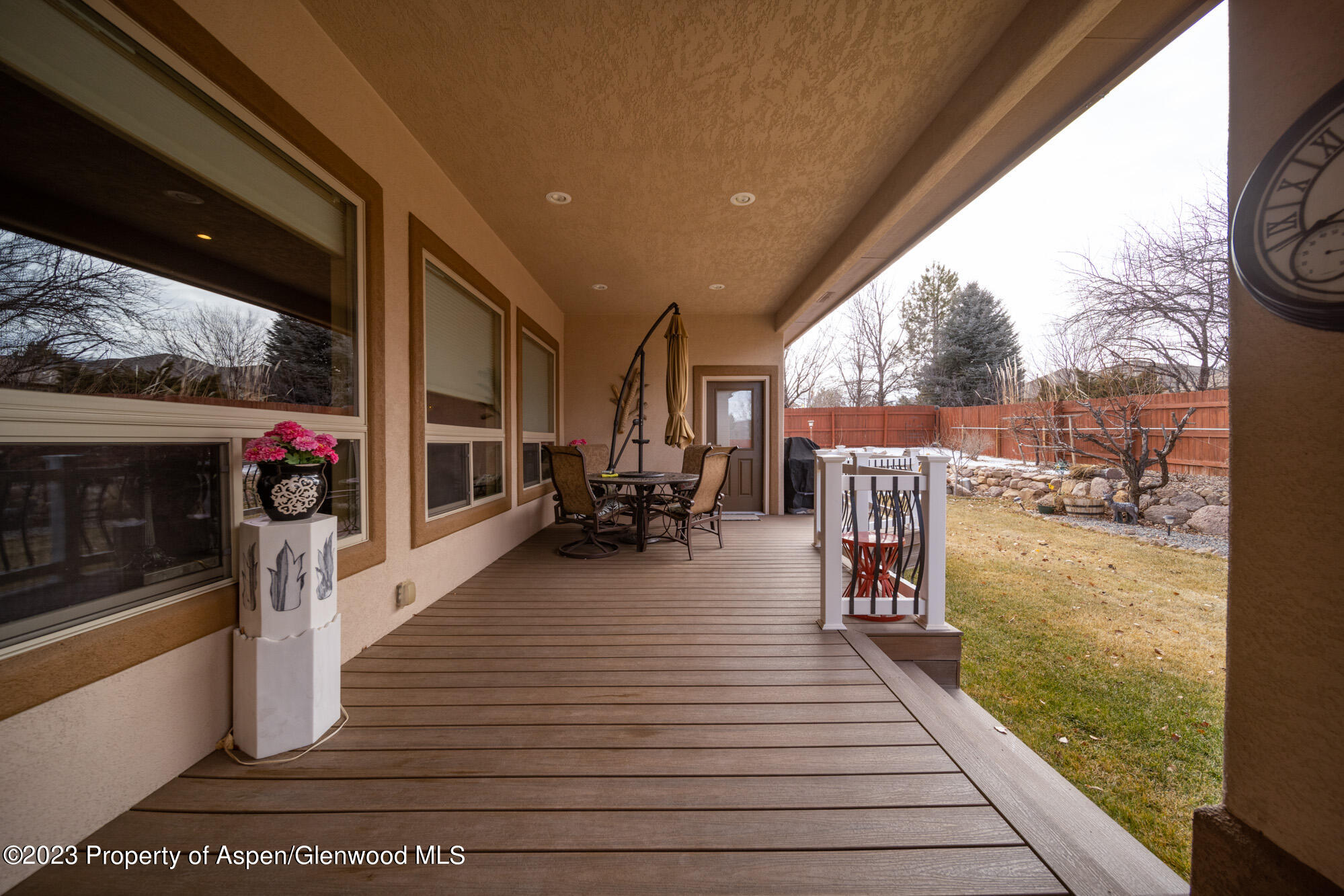 685 Roundup Drive Grand Junction, CO 81507 - Photo 37 of 39 a living room with furniture a wooden floor and next to a window