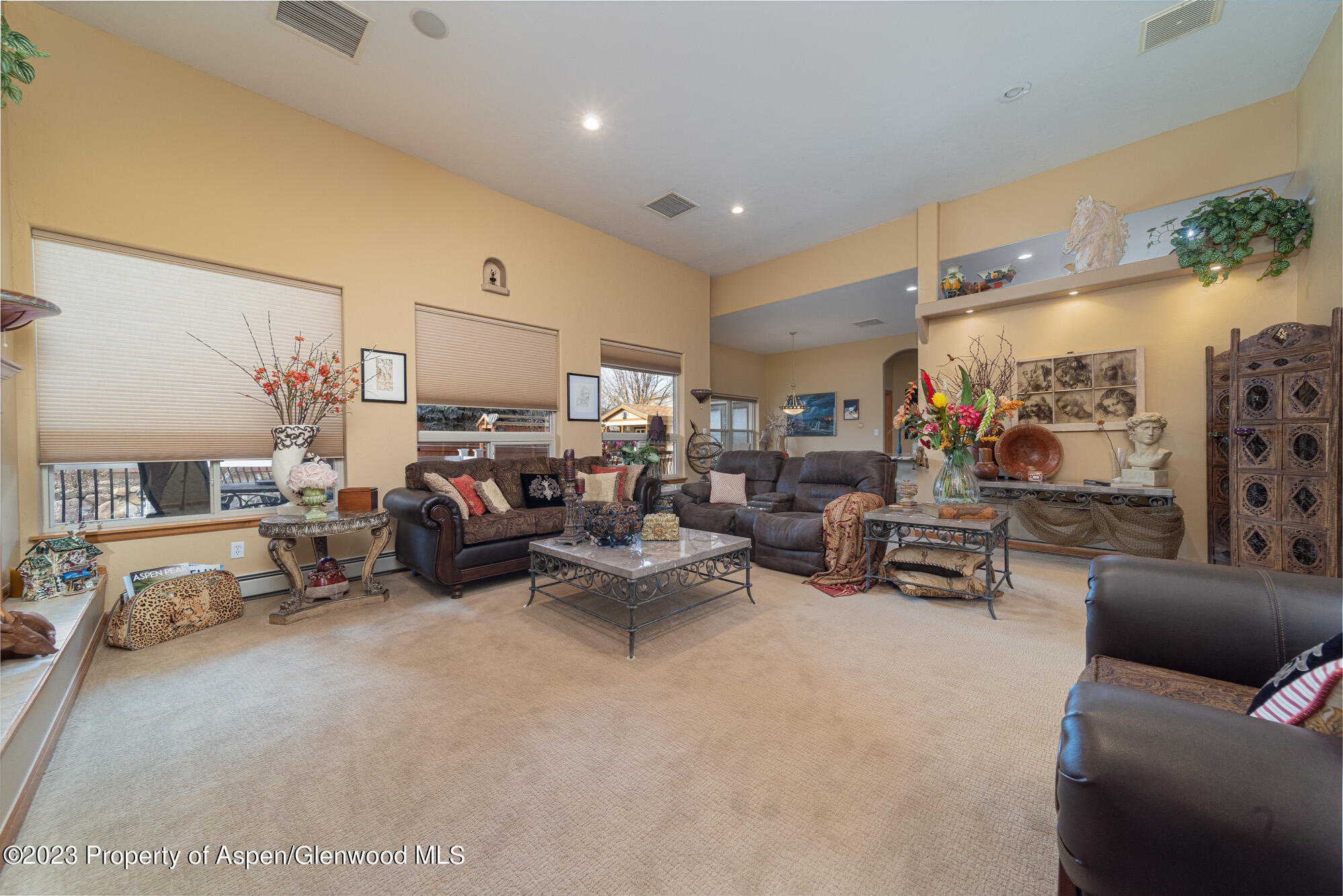 685 Roundup Drive Grand Junction, CO 81507 - Photo 7 of 39 a living room with furniture and a lamp