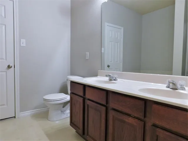 a white bath tub sitting next to a white sink