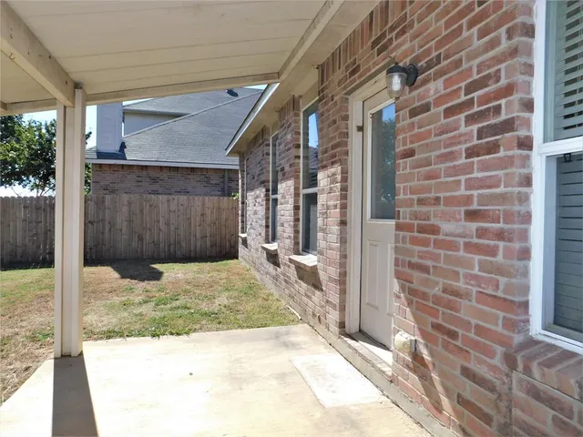 a big house with swimming pool in front of it