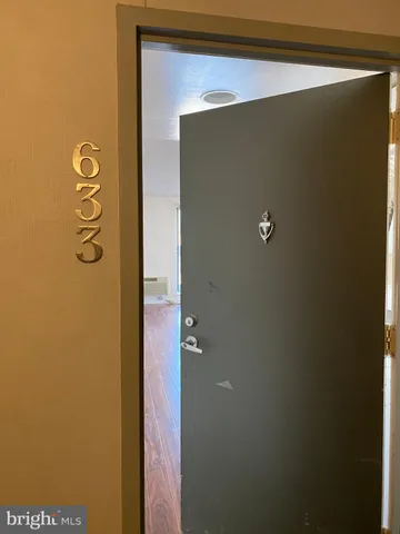 a kitchen with wooden floors and a sink