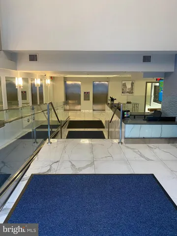 a front view of a building with sitting area