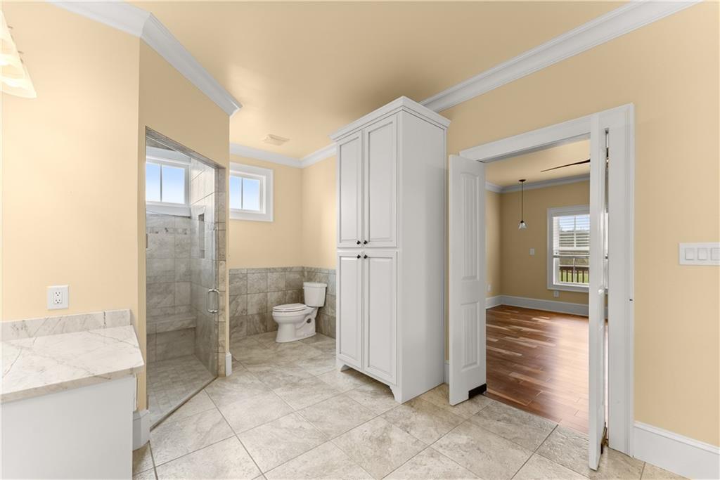 725 County Farm Road Jefferson, GA 30549 - Photo 30 of 66 a bathroom with a granite countertop sink and a mirror