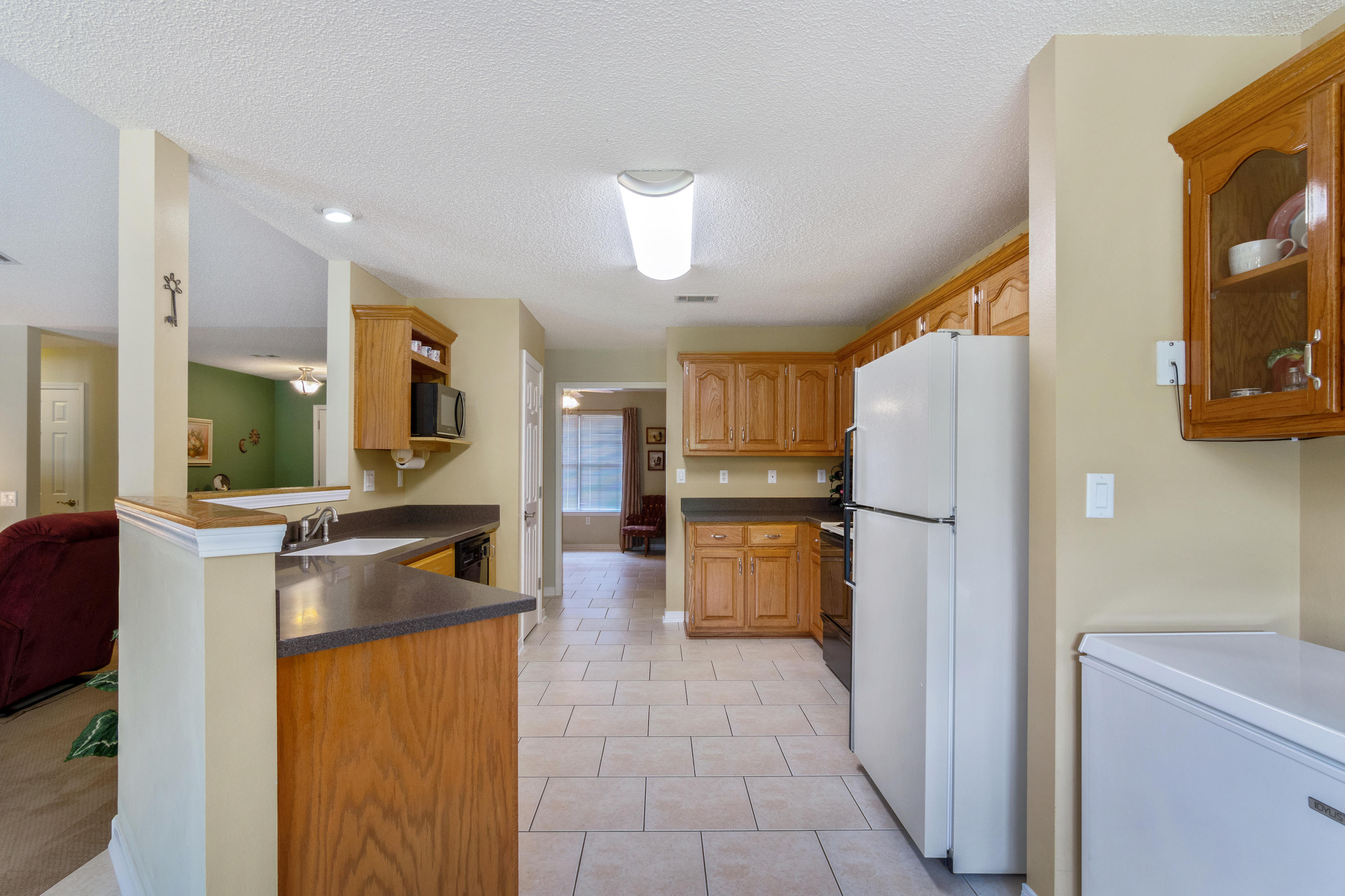 6151 Beasley Road Crestview, FL 32536 - Photo 24 of 49 a kitchen with stainless steel appliances granite countertop a refrigerator and a stove