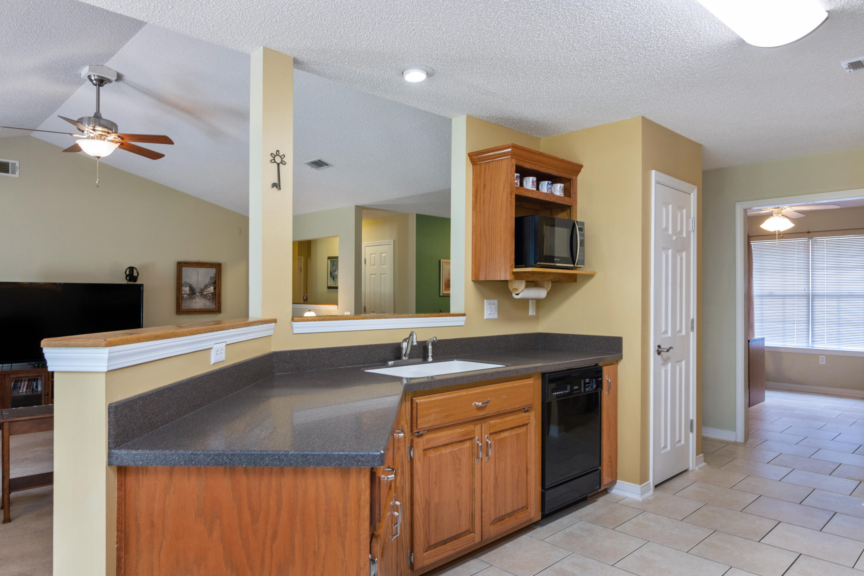 6151 Beasley Road Crestview, FL 32536 - Photo 25 of 49 a bathroom with a sink and a mirror
