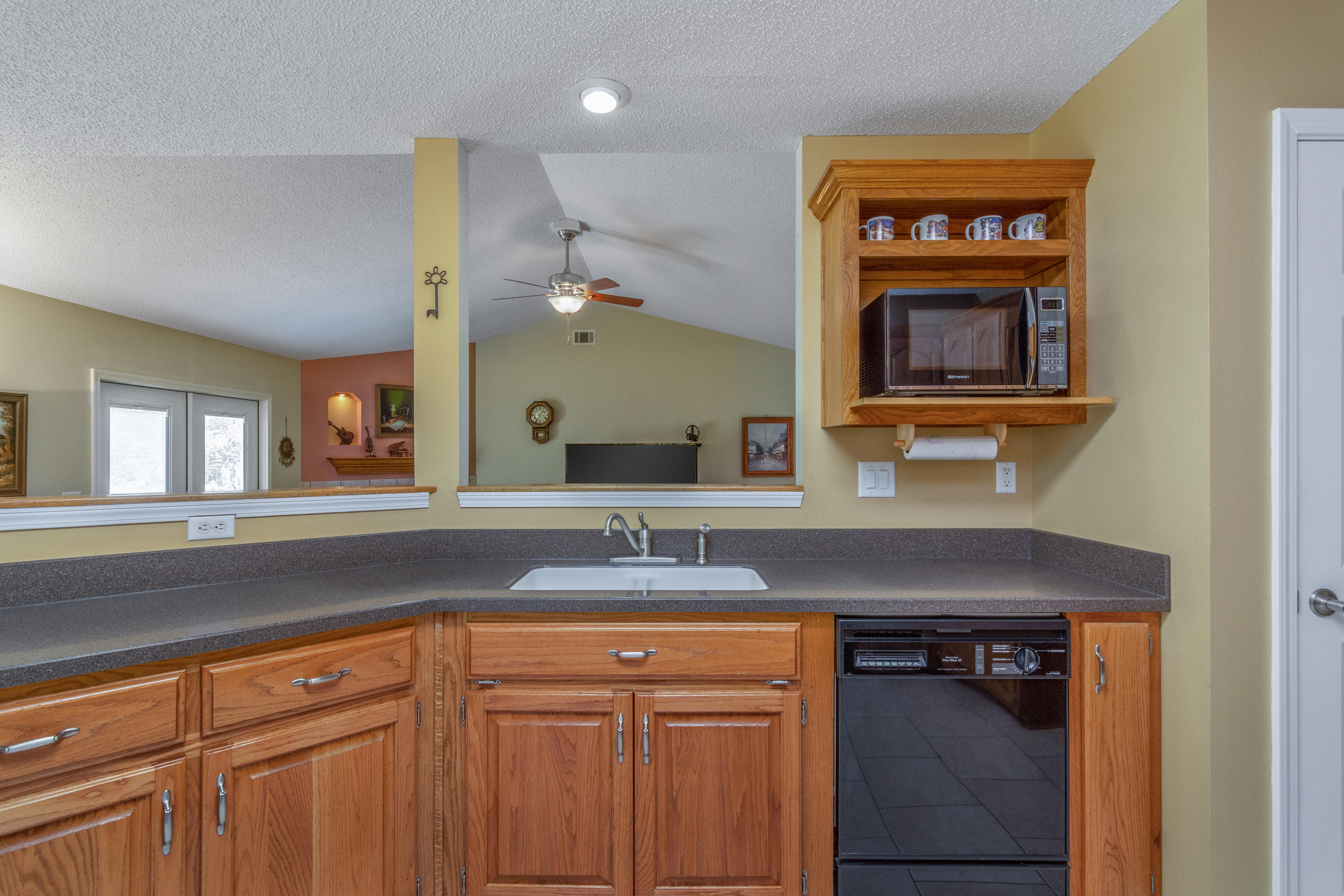 6151 Beasley Road Crestview, FL 32536 - Photo 29 of 49 a kitchen with a sink and a refrigerator