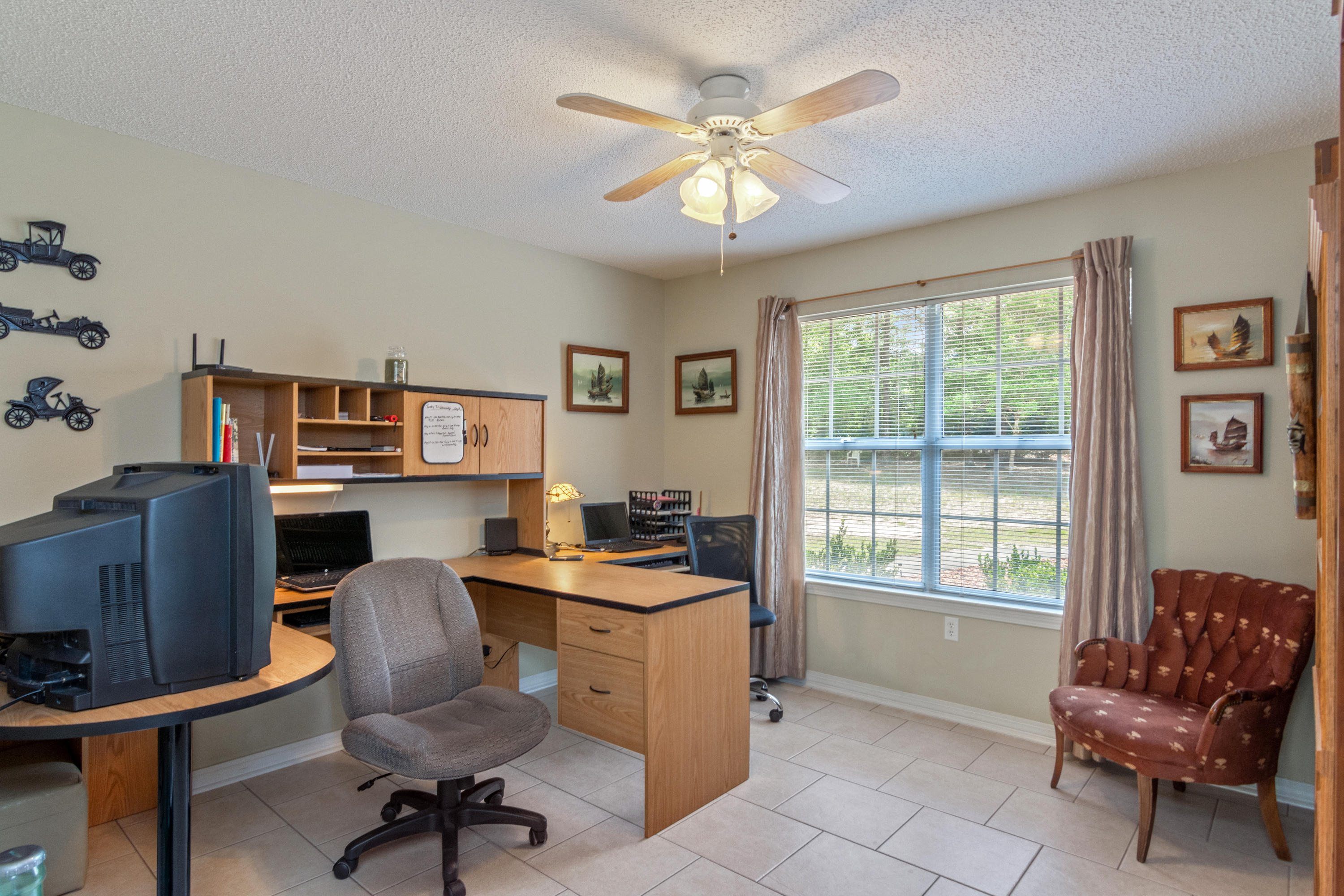 6151 Beasley Road Crestview, FL 32536 - Photo 30 of 49 a workspace with furniture and a window