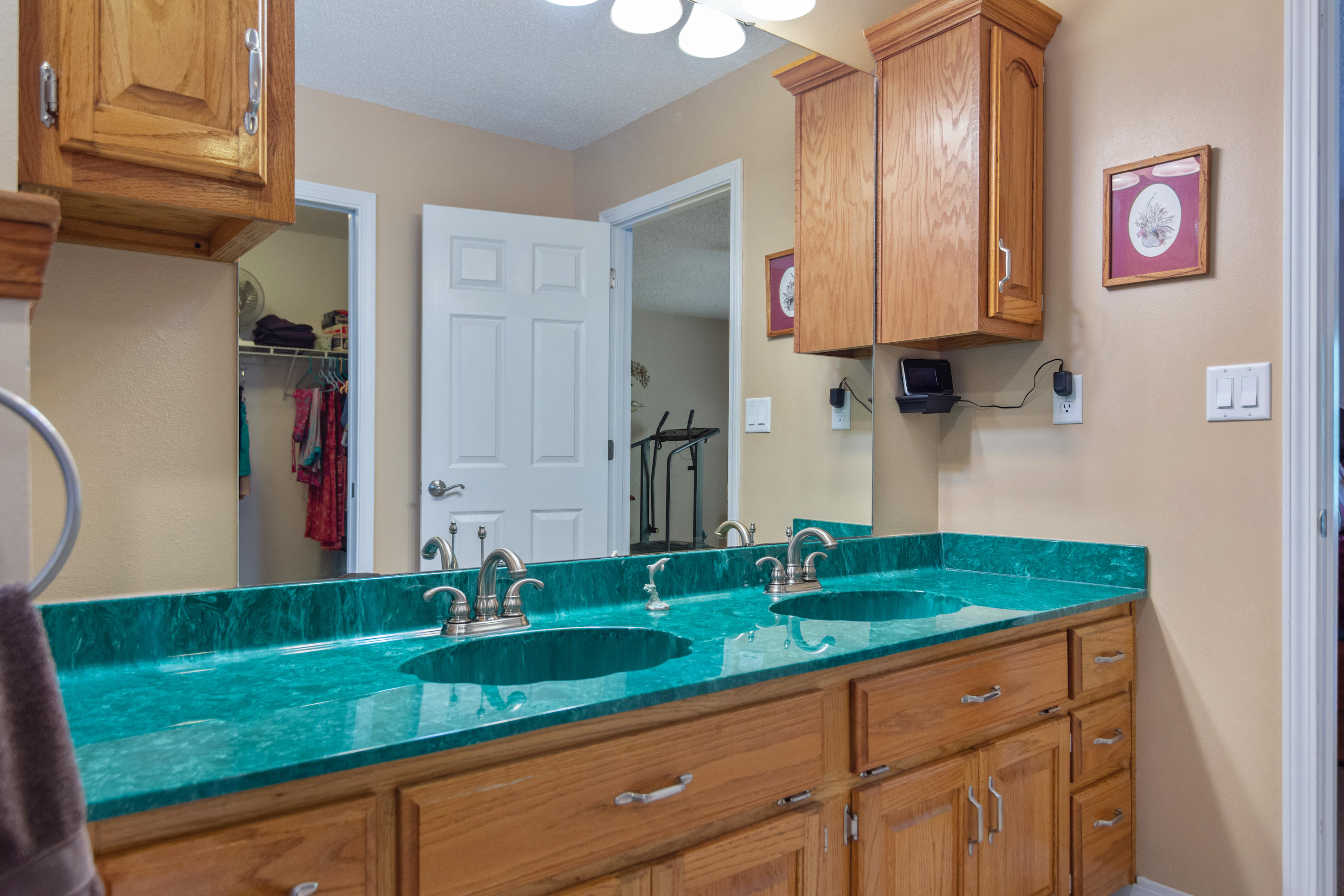 6151 Beasley Road Crestview, FL 32536 - Photo 38 of 49 a bathroom with a granite countertop sink and a mirror