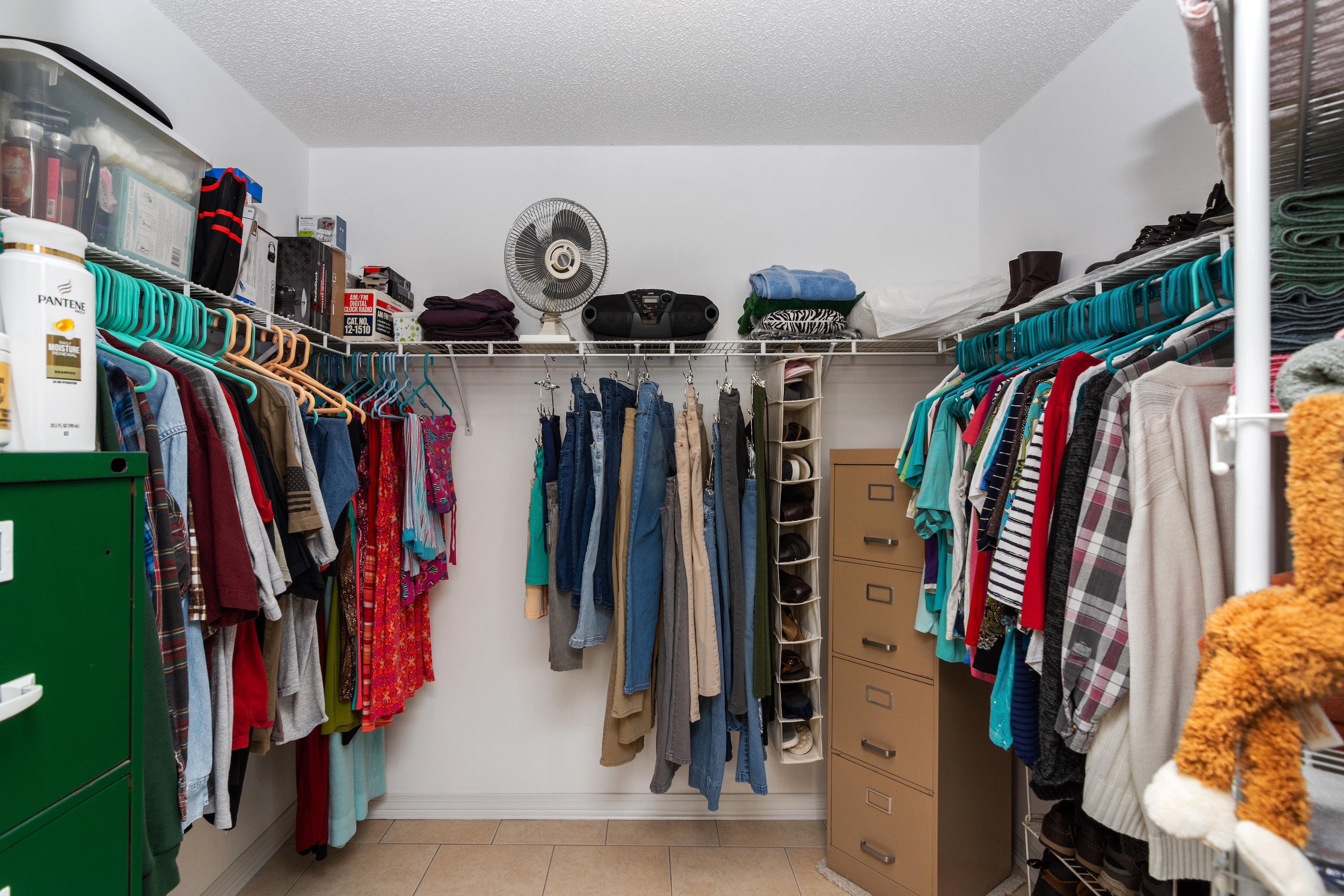 6151 Beasley Road Crestview, FL 32536 - Photo 39 of 49 a view of walk in closet with clothes