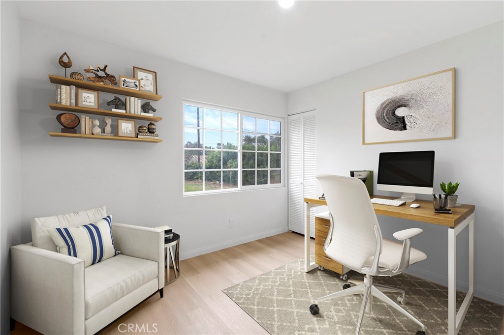 5847 Meadowbrook Lane Riverside, CA 92504 - Photo 17 of 31 a work room with furniture and a flat screen tv