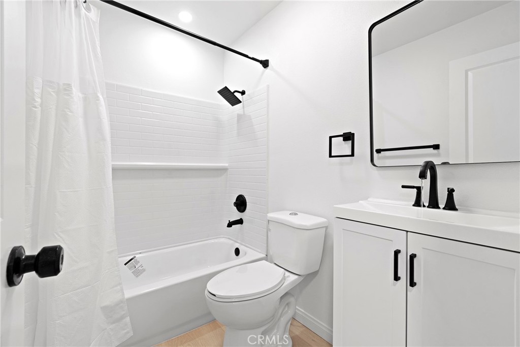 5847 Meadowbrook Lane Riverside, CA 92504 - Photo 20 of 31 a bathroom with a sink a toilet and shower