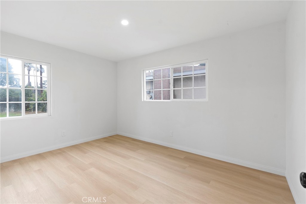 5847 Meadowbrook Lane Riverside, CA 92504 - Photo 22 of 31 an empty room with a window