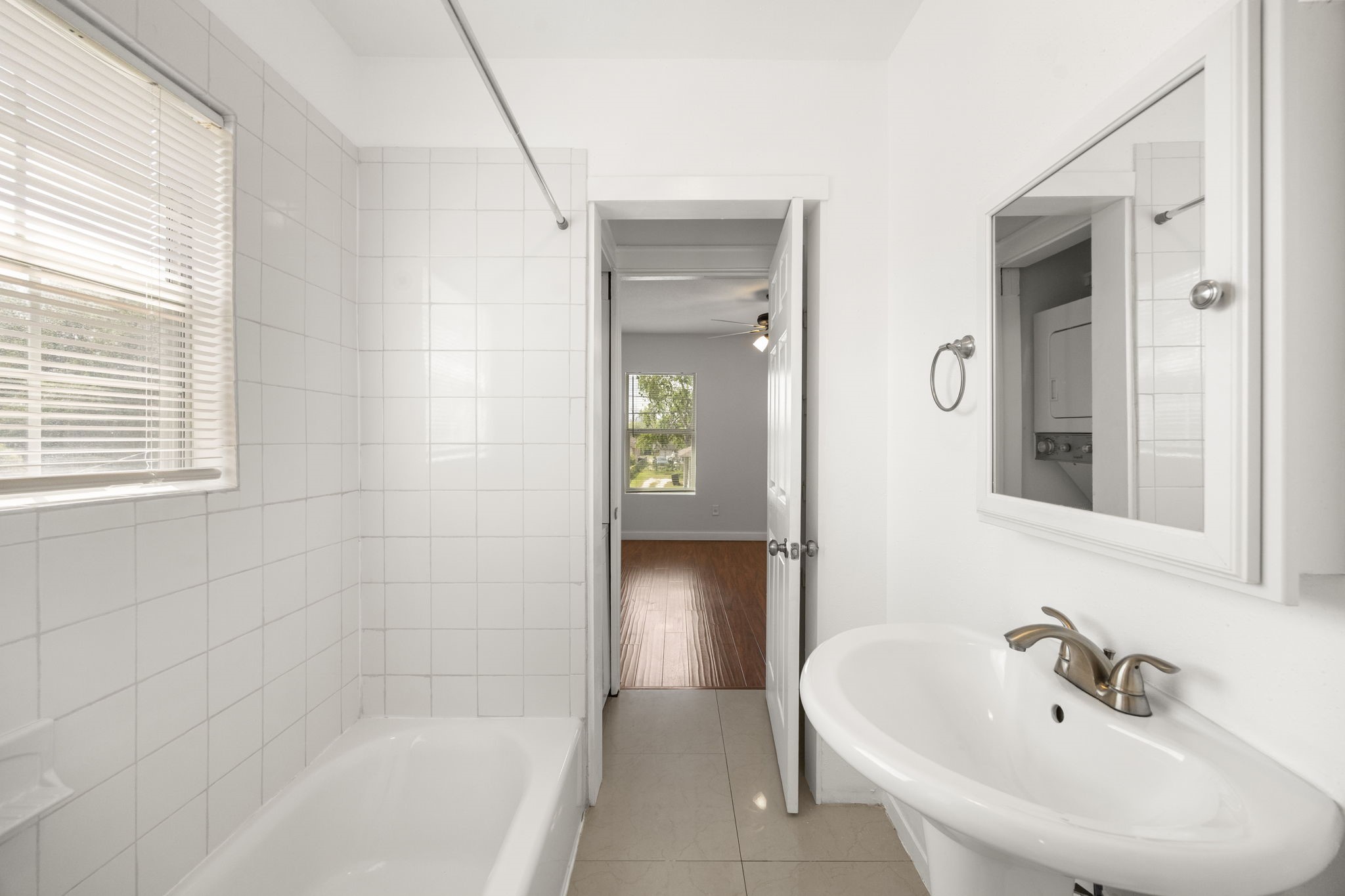 7 Latham Street Houston, TX 77011 - Photo 15 of 23 Bathroom offers convenient access from both the living area and bedroom.