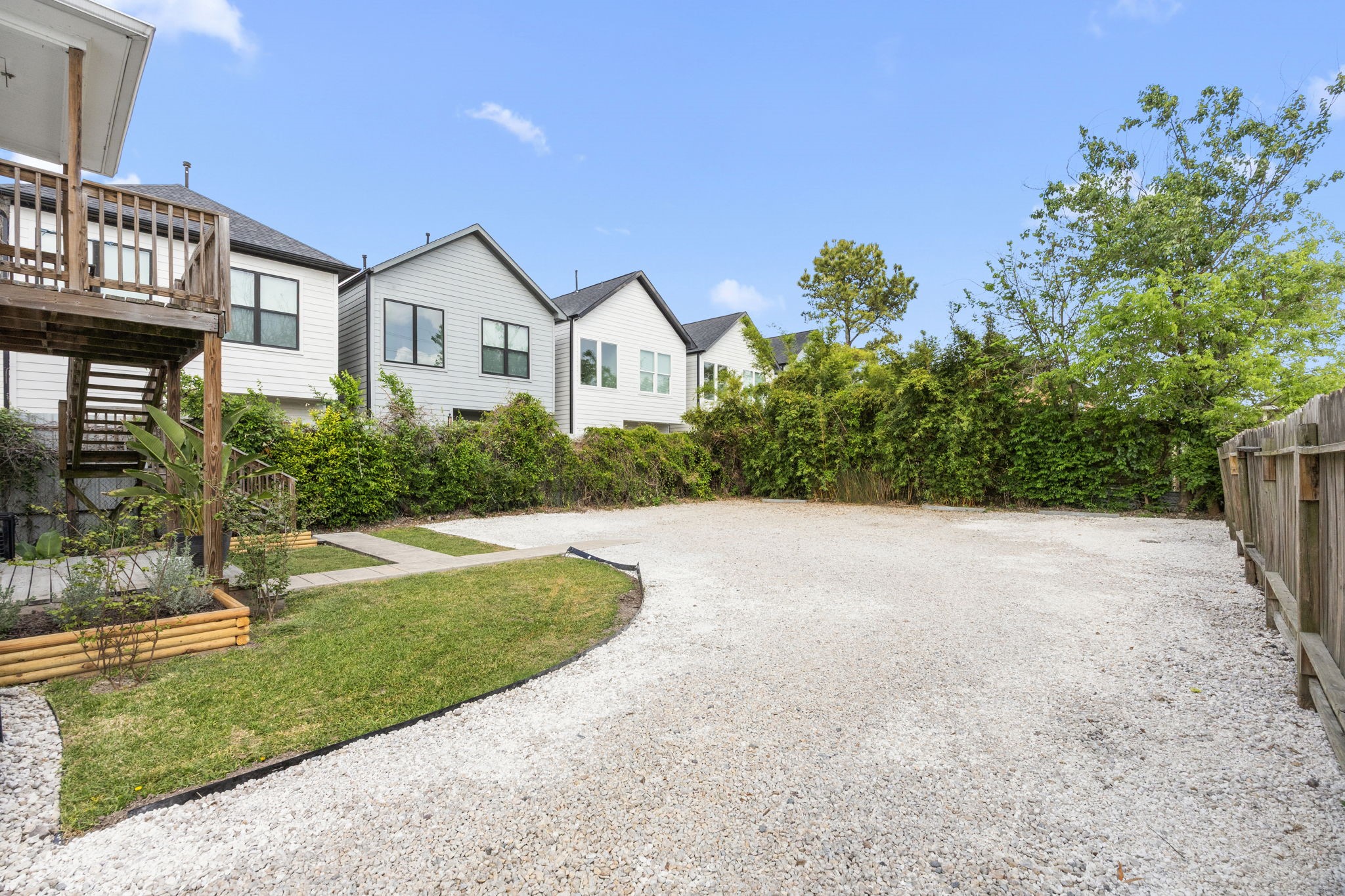 7 Latham Street Houston, TX 77011 - Photo 19 of 23 Expansive gravel parking area offering ample off-street parking for multiple tenants.