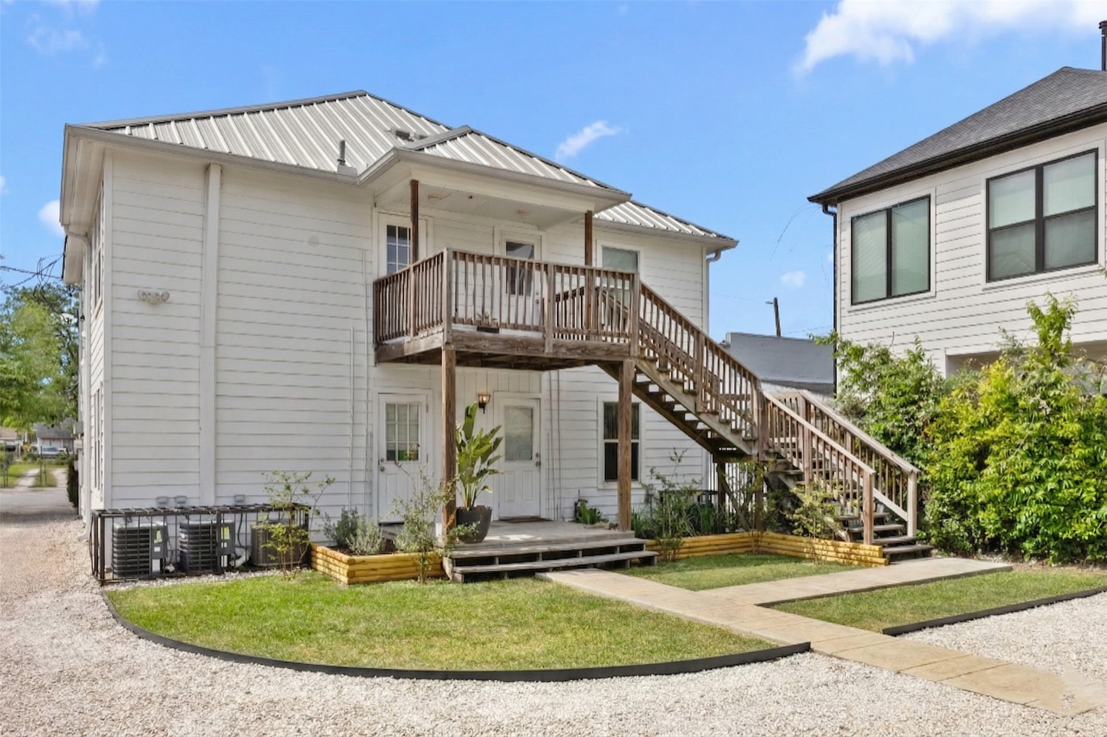 7 Latham Street Houston, TX 77011 - Photo 3 of 23 The rear stairs were redone recently, and the landscaping was spruced up for the new owner.