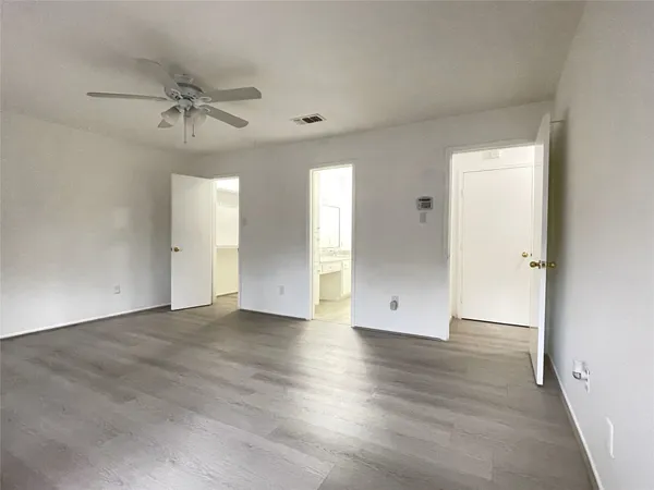 a spacious bathroom with a double vanity sink a mirror and a shower
