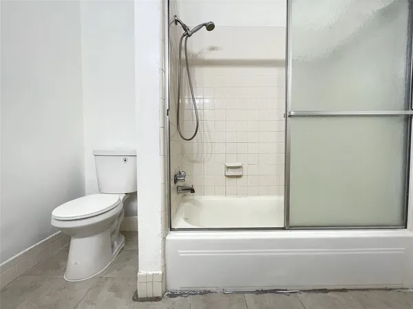 a spacious bathroom with a double vanity sink and a mirror