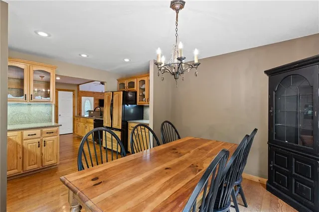 a dining room with furniture and chandelier