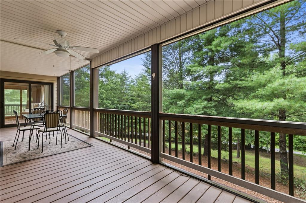 2930 Hicks Gap Road Blairsville, GA 30512 - Photo 24 of 44 a view of a balcony with furniture and wooden floor