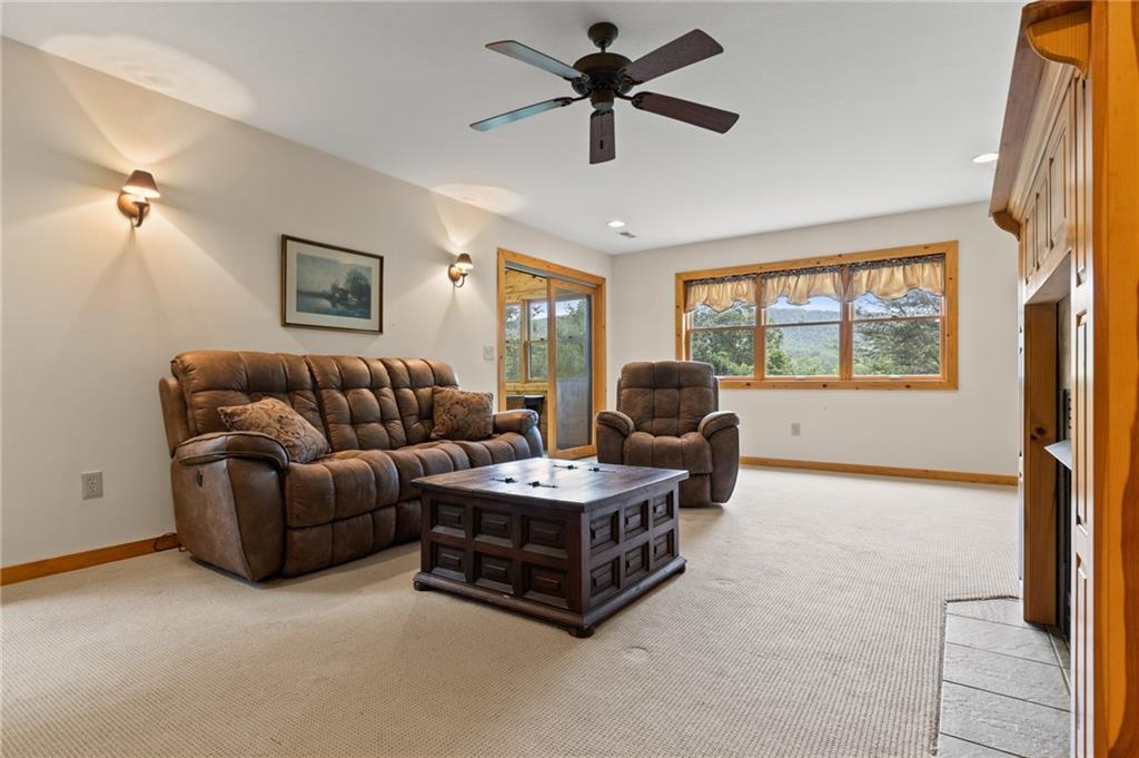 2930 Hicks Gap Road Blairsville, GA 30512 - Photo 31 of 44 a living room with furniture a ceiling fan and a window
