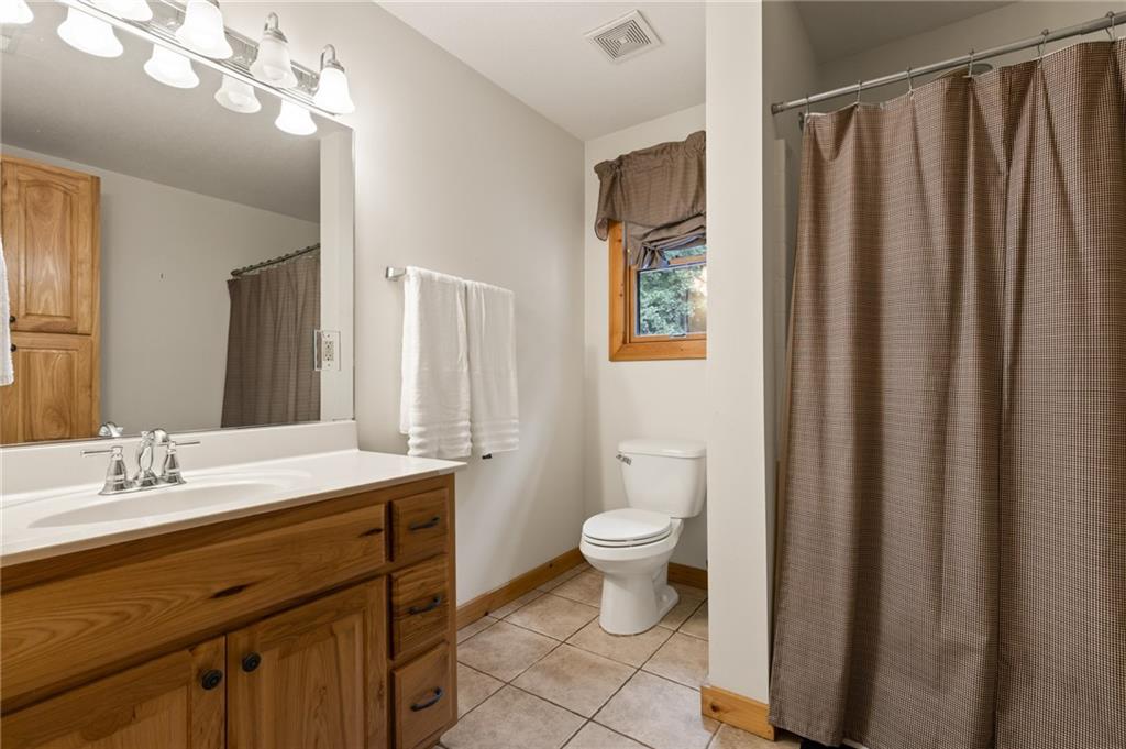 2930 Hicks Gap Road Blairsville, GA 30512 - Photo 35 of 44 a bathroom with a sink a toilet and a mirror