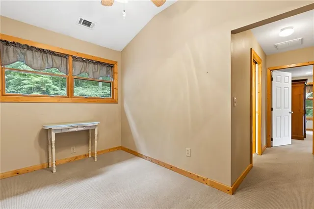 a view of an empty room and window