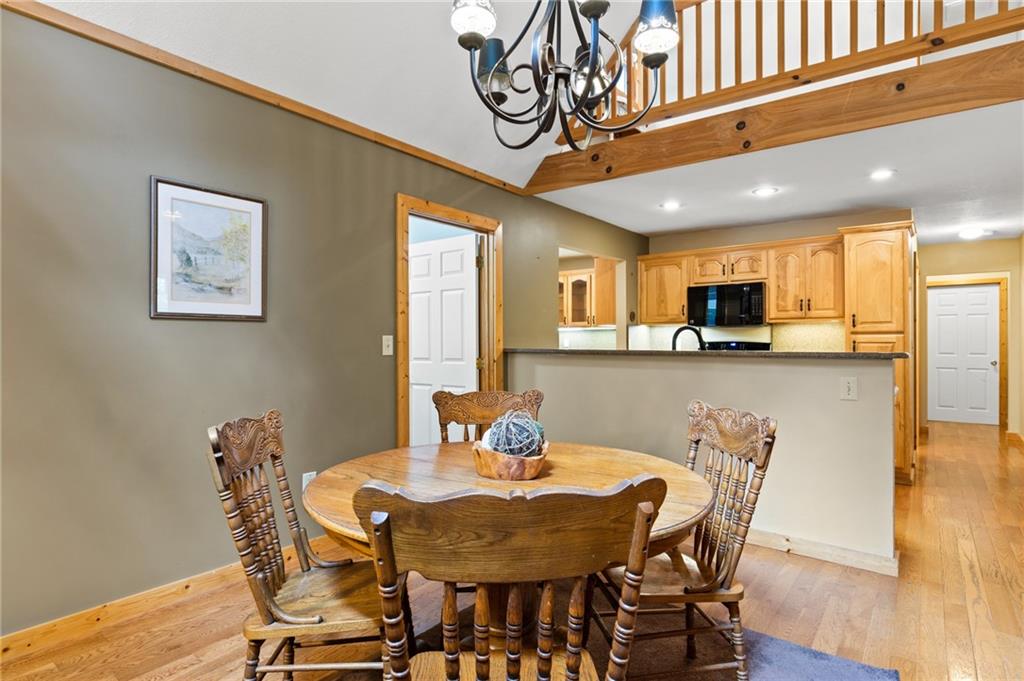 2930 Hicks Gap Road Blairsville, GA 30512 - Photo 7 of 44 a view of a dining room with furniture and wooden floor