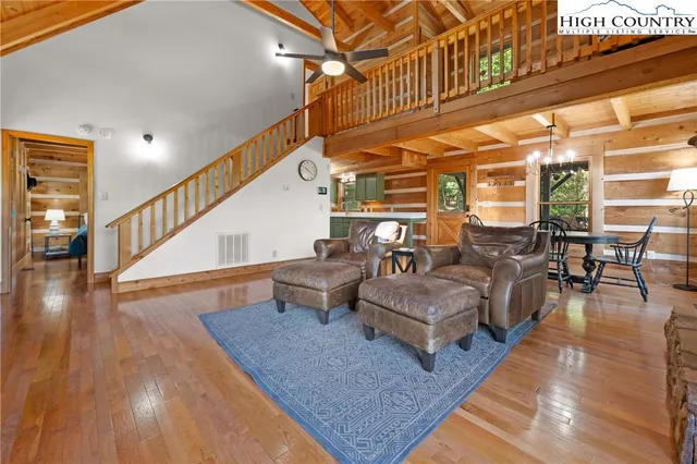 a kitchen with granite countertop a sink a stove and wooden cabinets