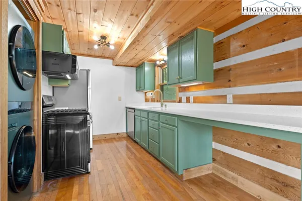 a kitchen with stainless steel appliances granite countertop a stove and a sink