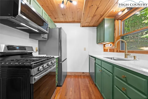 a view of a hallway with washer and dryer