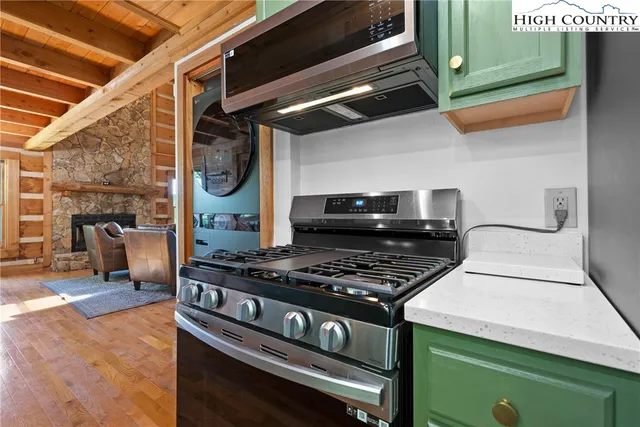 a bedroom with a bed and a large window with the outer view