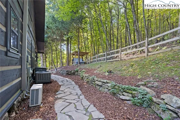 a view of a house with wooden fence