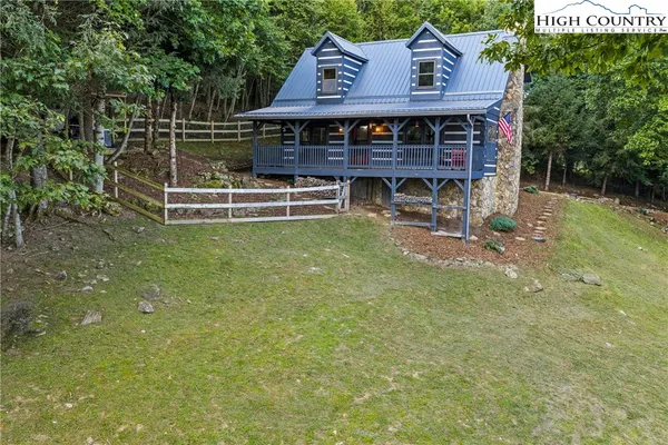 a view of a field with trees in the background