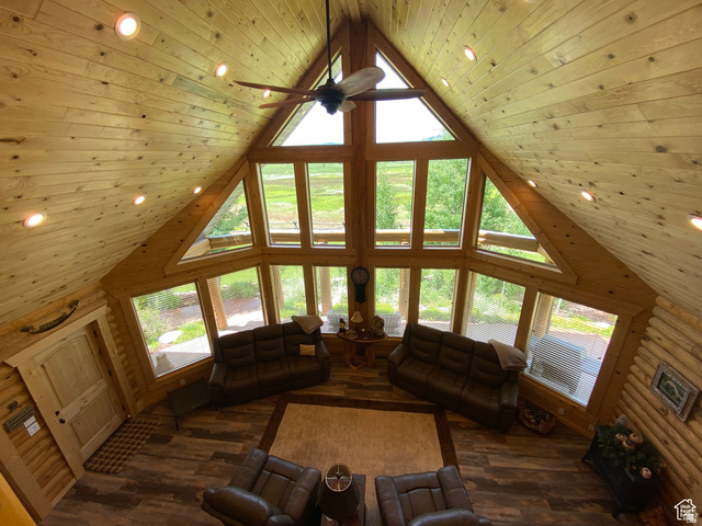 79 Auburn Forest Road Auburn, WY 83111 - Photo 40 of 76 Living room featuring recessed lighting, a high wooden ceiling, ceiling fan, plenty of natural light, and dark wood finished floors