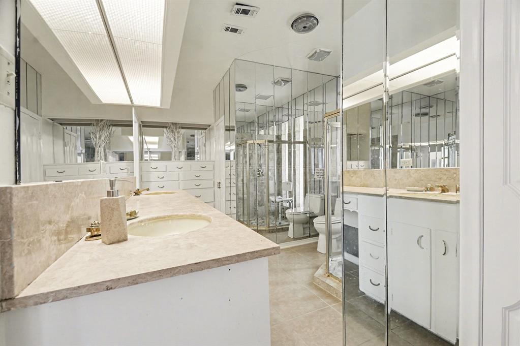14140 Hillcrest Road Dallas, TX 75254 - Photo 12 of 29 a bathroom with a sink and a shower