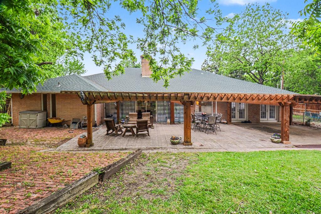 14140 Hillcrest Road Dallas, TX 75254 - Photo 27 of 29 a view of outdoor space yard deck patio and outdoor kitchen