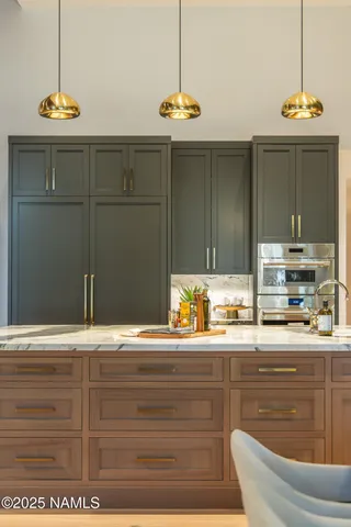 a kitchen with a table and chairs in it