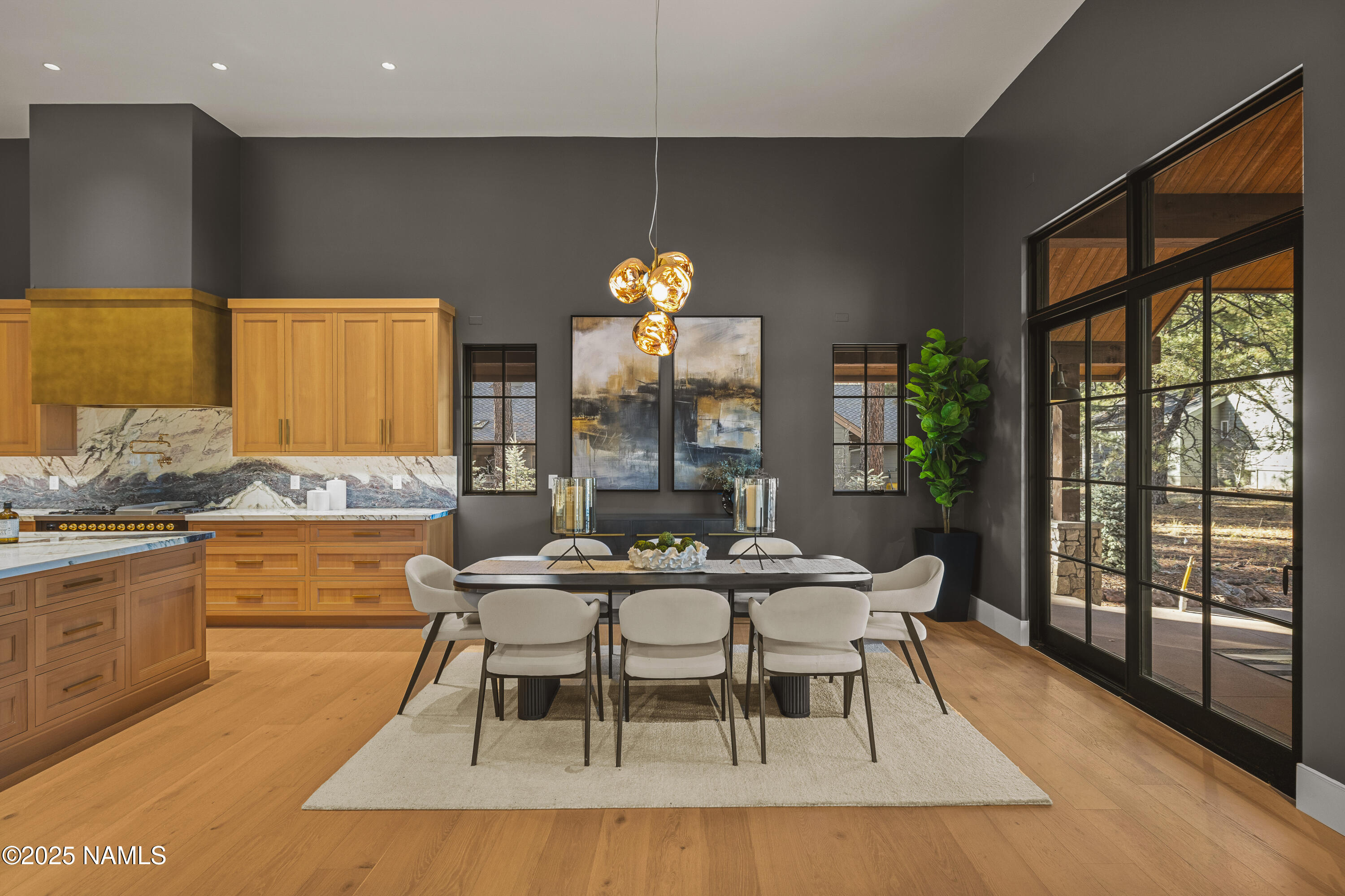 2732 Lindberg Flagstaff, AZ 86005 - Photo 18 of 56 a dining room with furniture a chandelier and wooden floor
