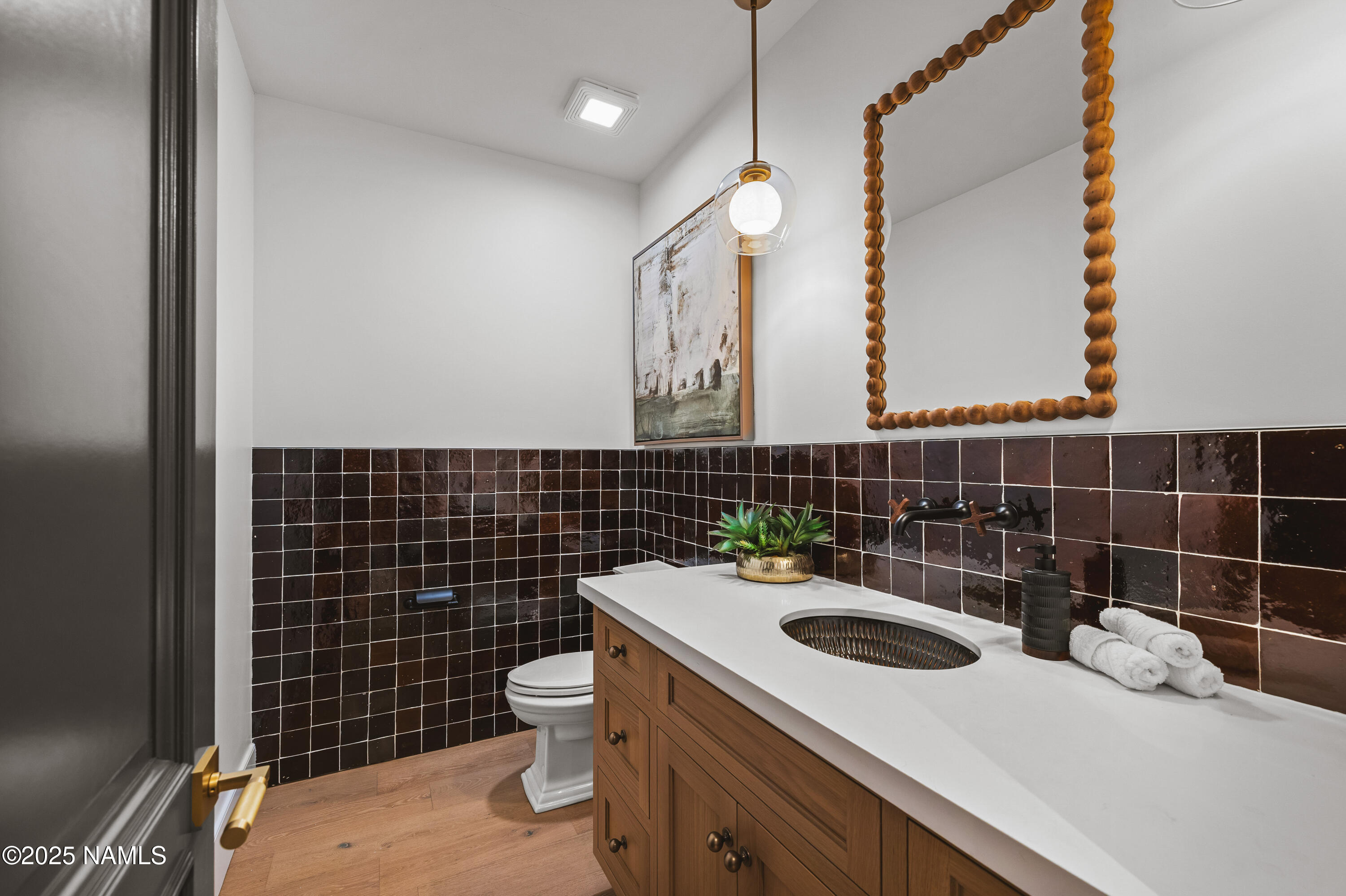 2732 Lindberg Flagstaff, AZ 86005 - Photo 39 of 56 a bathroom with a sink a toilet and a mirror