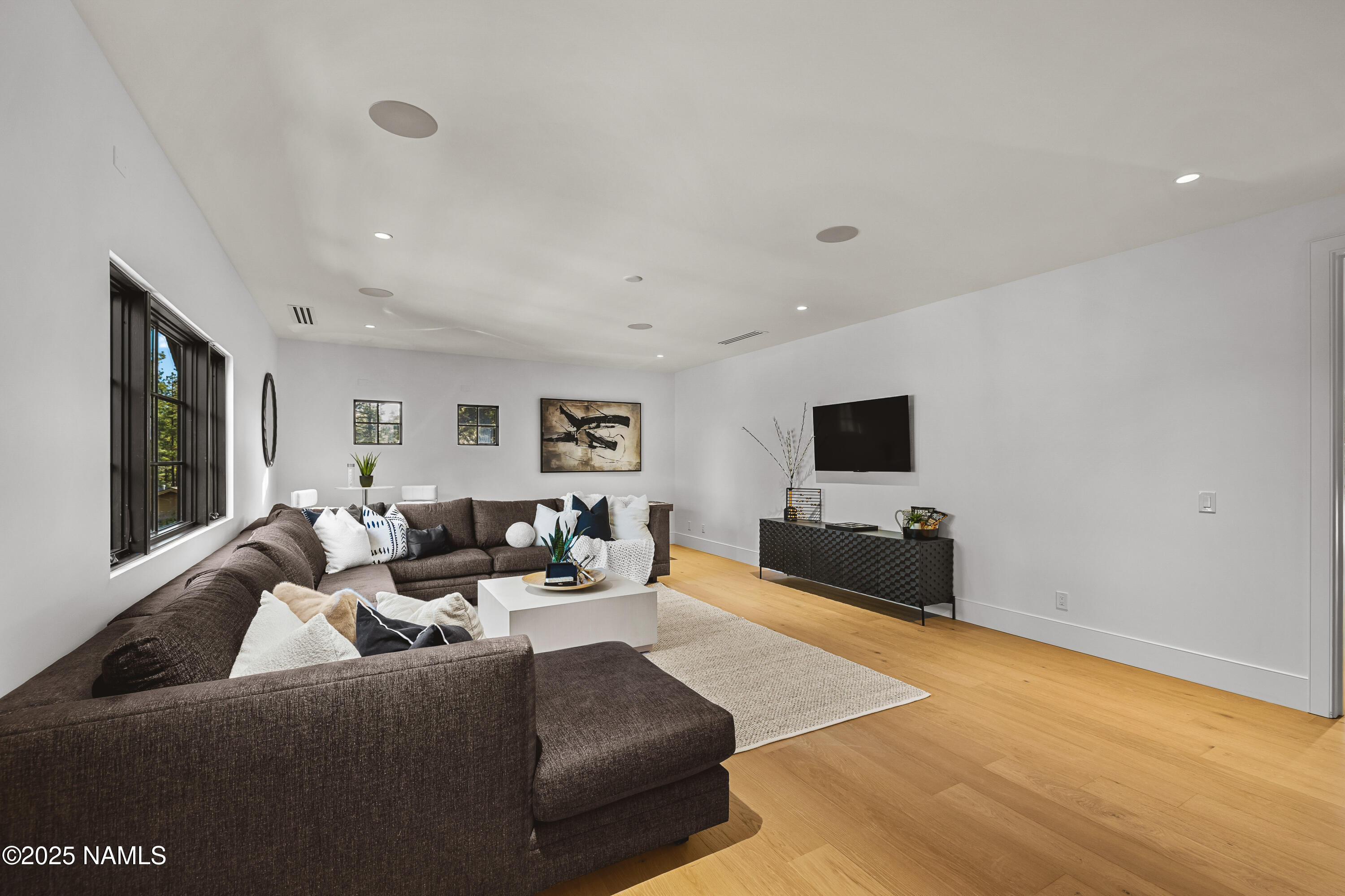2732 Lindberg Flagstaff, AZ 86005 - Photo 41 of 56 a living room with furniture and a flat screen tv