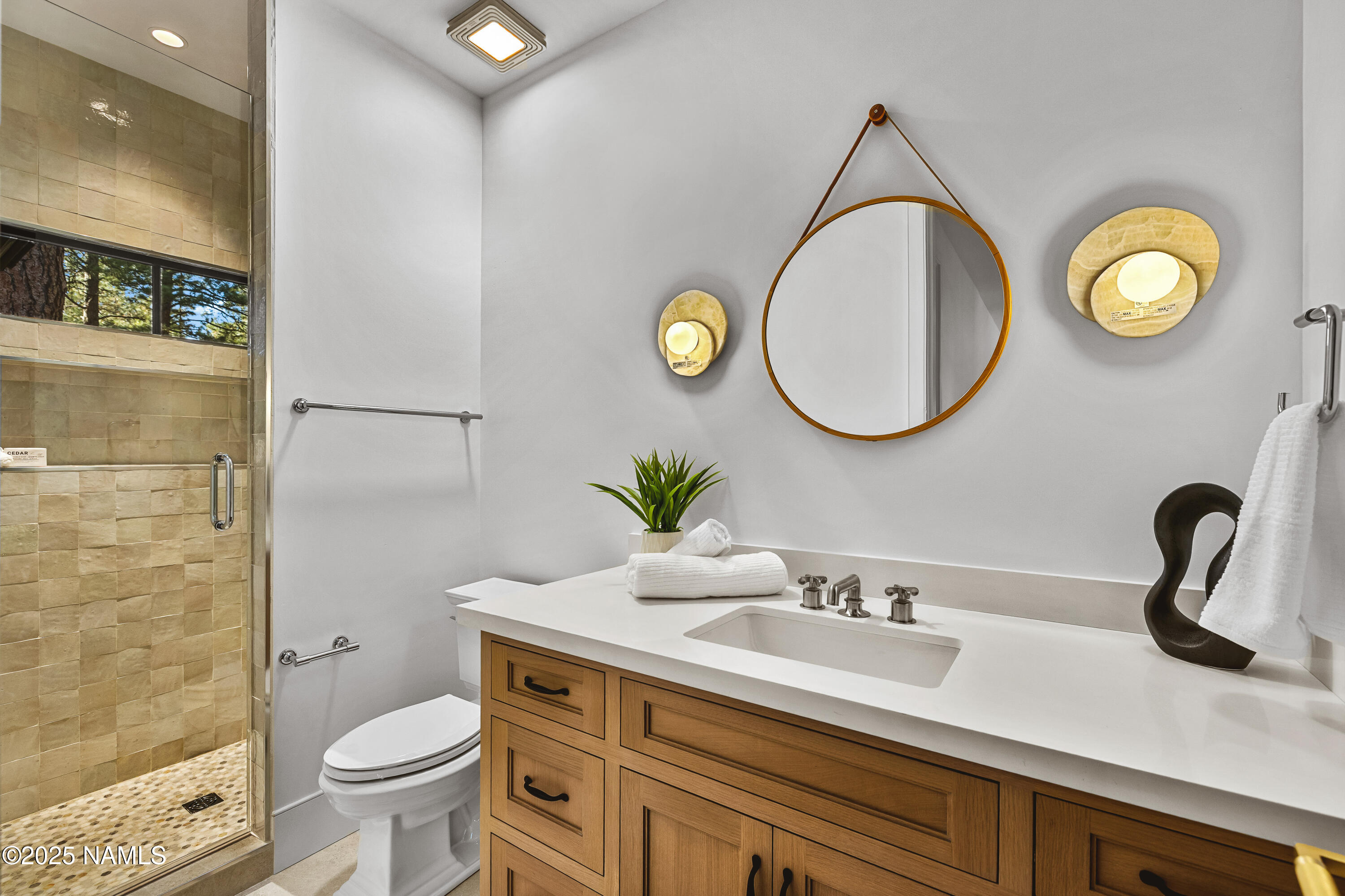 2732 Lindberg Flagstaff, AZ 86005 - Photo 43 of 56 a bathroom with a toilet sink and mirror