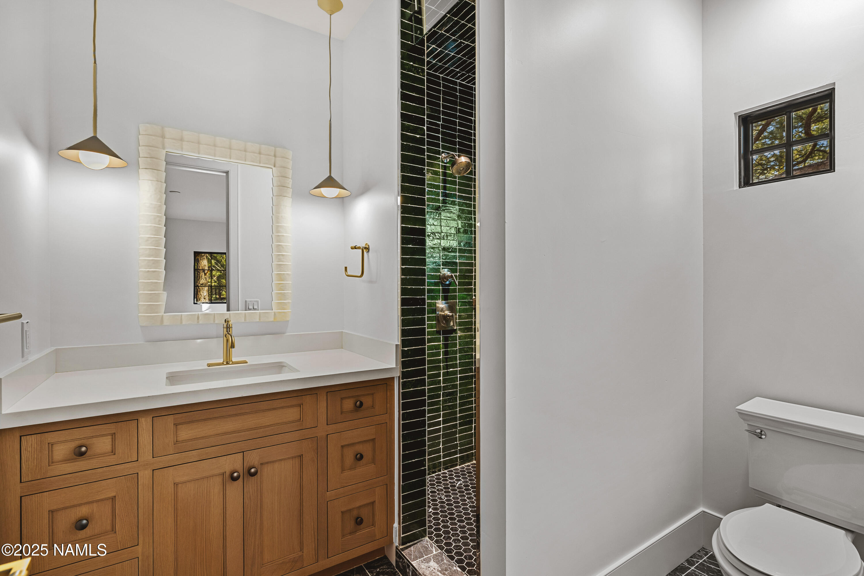 2732 Lindberg Flagstaff, AZ 86005 - Photo 45 of 56 a bathroom with a sink a toilet and shower